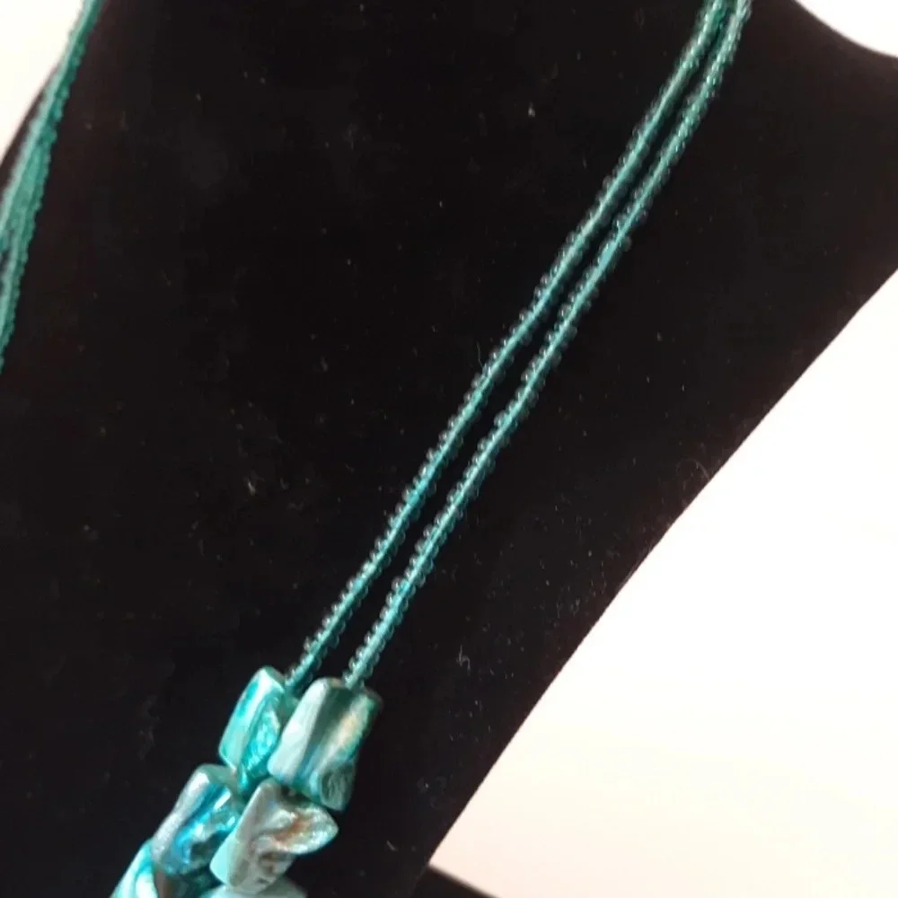 2 strand shell like turquoise necklace.